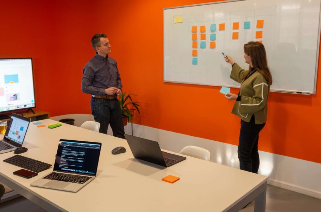 Services Marketing consultant explaining business growth strategy to clients